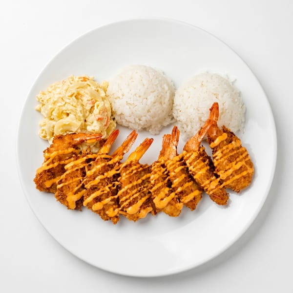Crispy fried shrimp drizzled with orange sauce, served with two scoops of rice and macaroni salad.